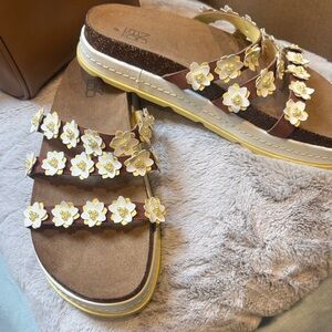 No Boundaries Brown Slide Sandals with White Flower Appliqués and Yellow Trim